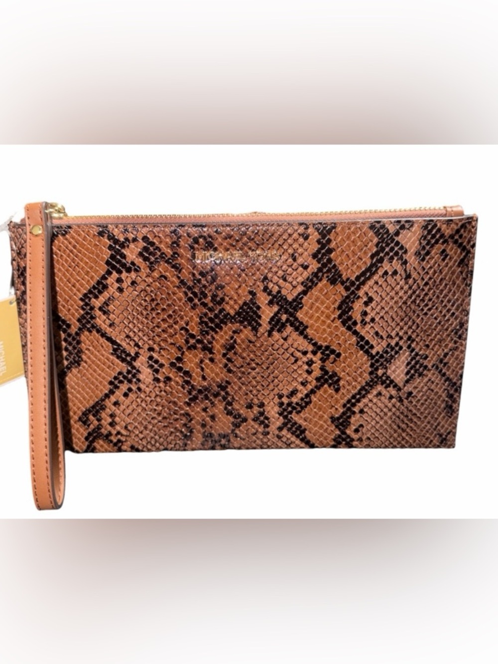 Michael Kors Jet Set Travel Large Zip Clutch in a brown snake-embossed leather